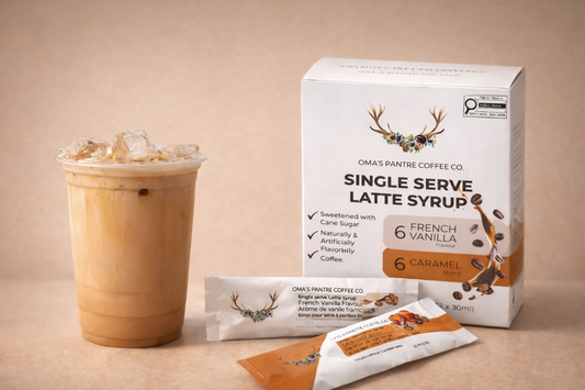 Oma's Pantre Coffee Co. single serve latte syrup packaging with a cup of iced latte on a beige background